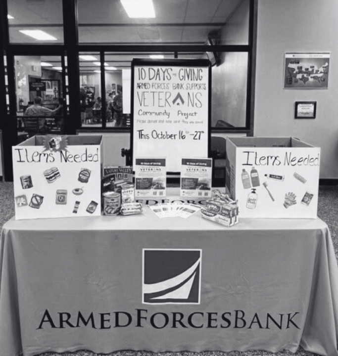 Days of giving table set up at Armed Forces Bank to encourage clients to give as well