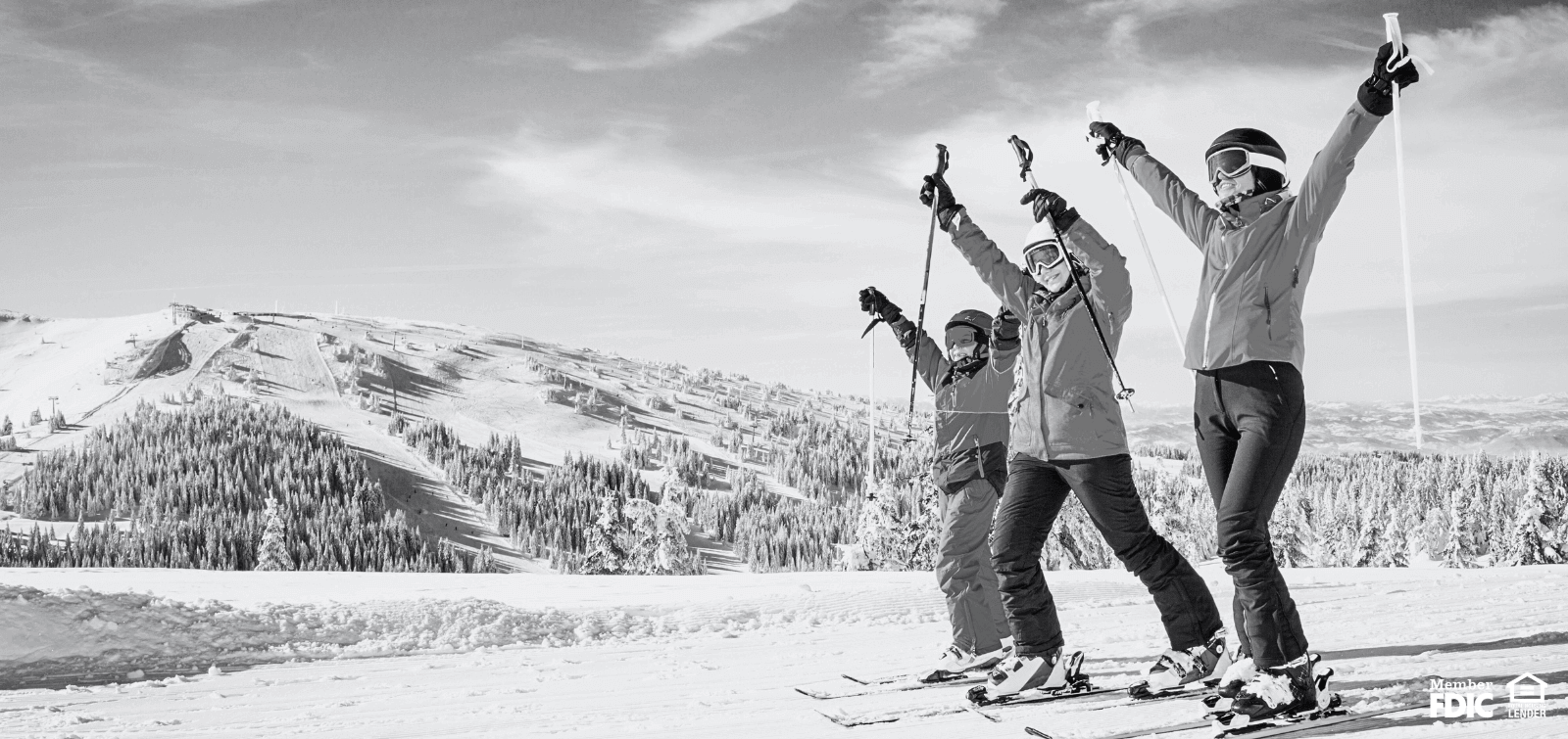 A family celebrates while on a skiing holiday together