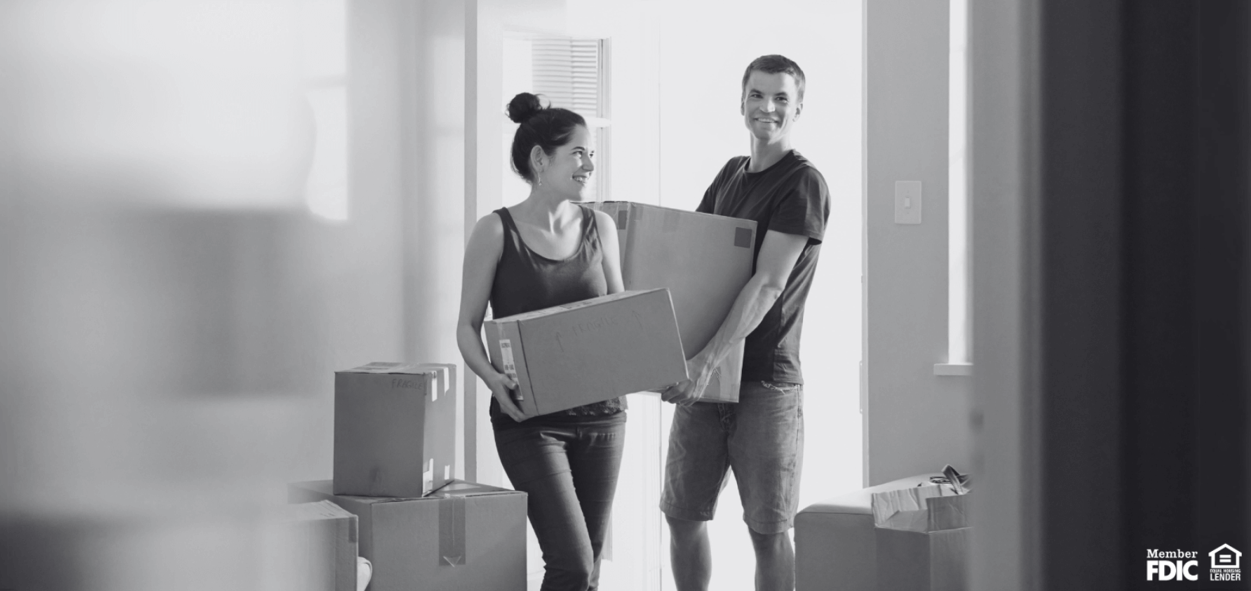 a couple moves into a new home they bought with an FHA loan