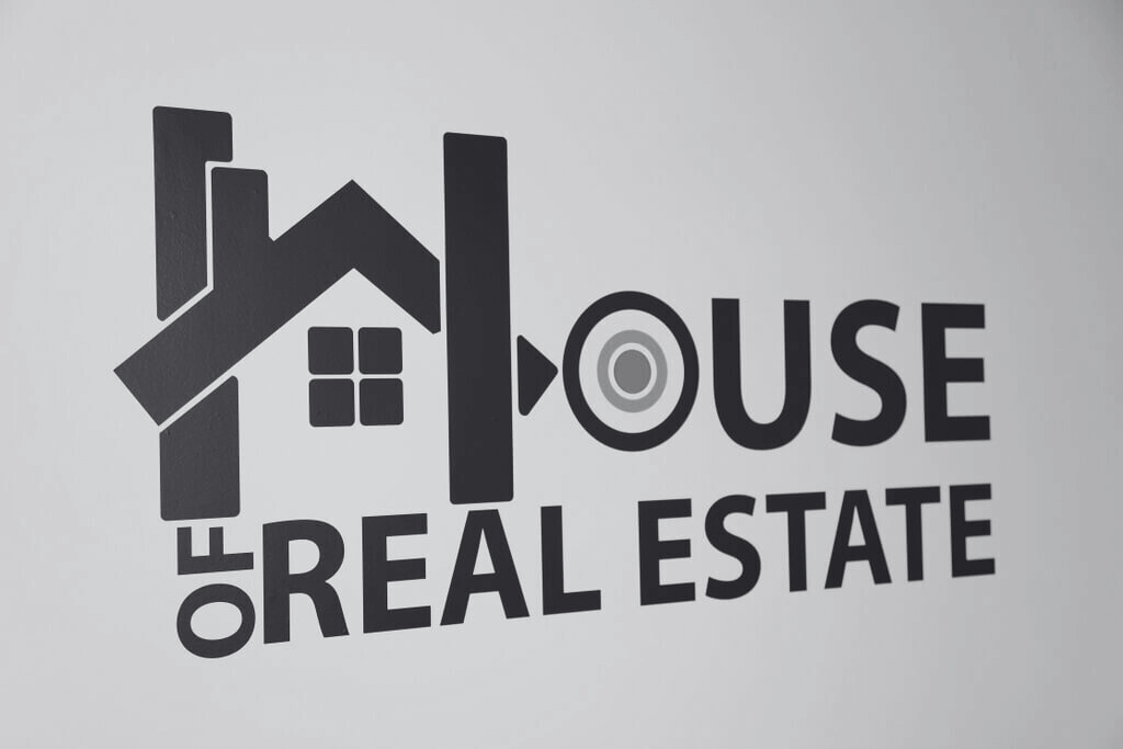 House of Real Estate's logo