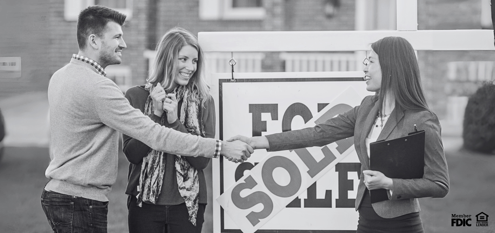 a couple celebrates new home they bought with a mortgage