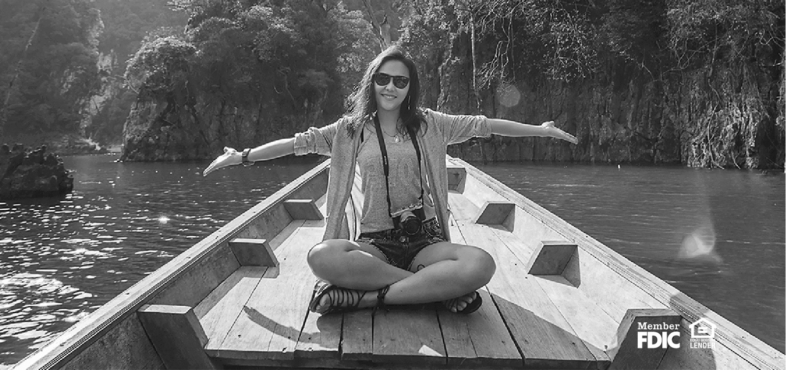 a woman poses on a boat during vacation